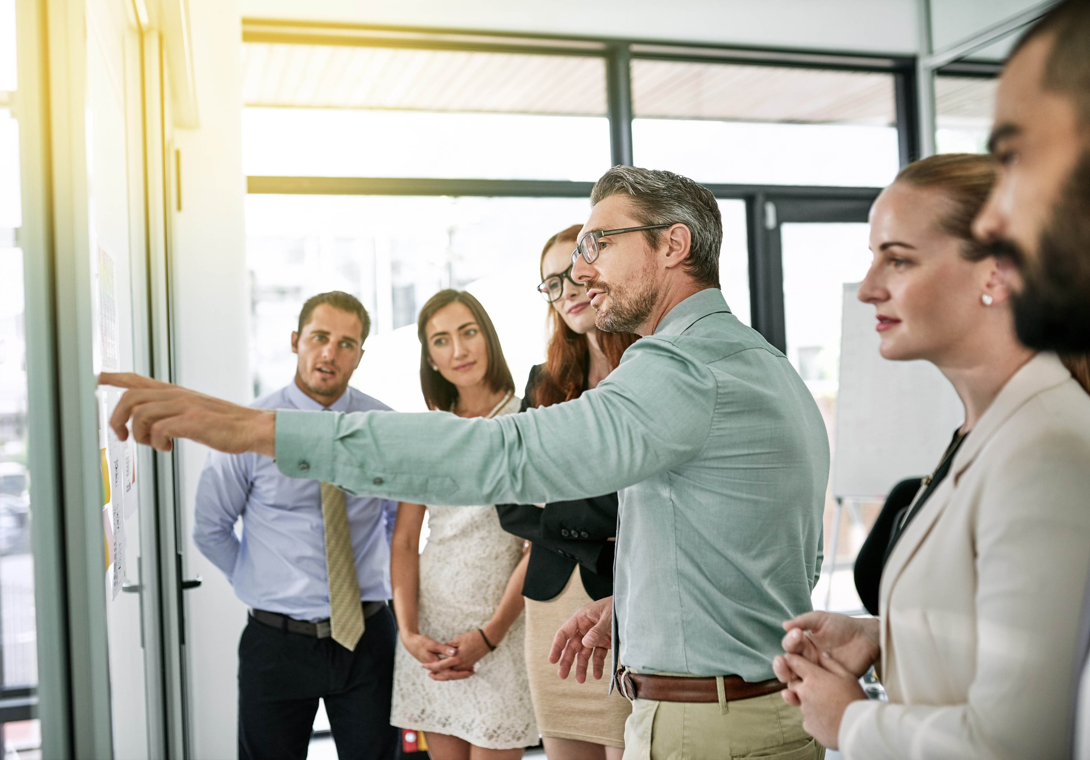 Business People, Glass Wall or Mentor in Meeting for Brainstorming Ideas, Schedule or Teamwork. Group, Training or Staff in Office Discussion for Solution, Planning and Project in Creative Agency.jpg